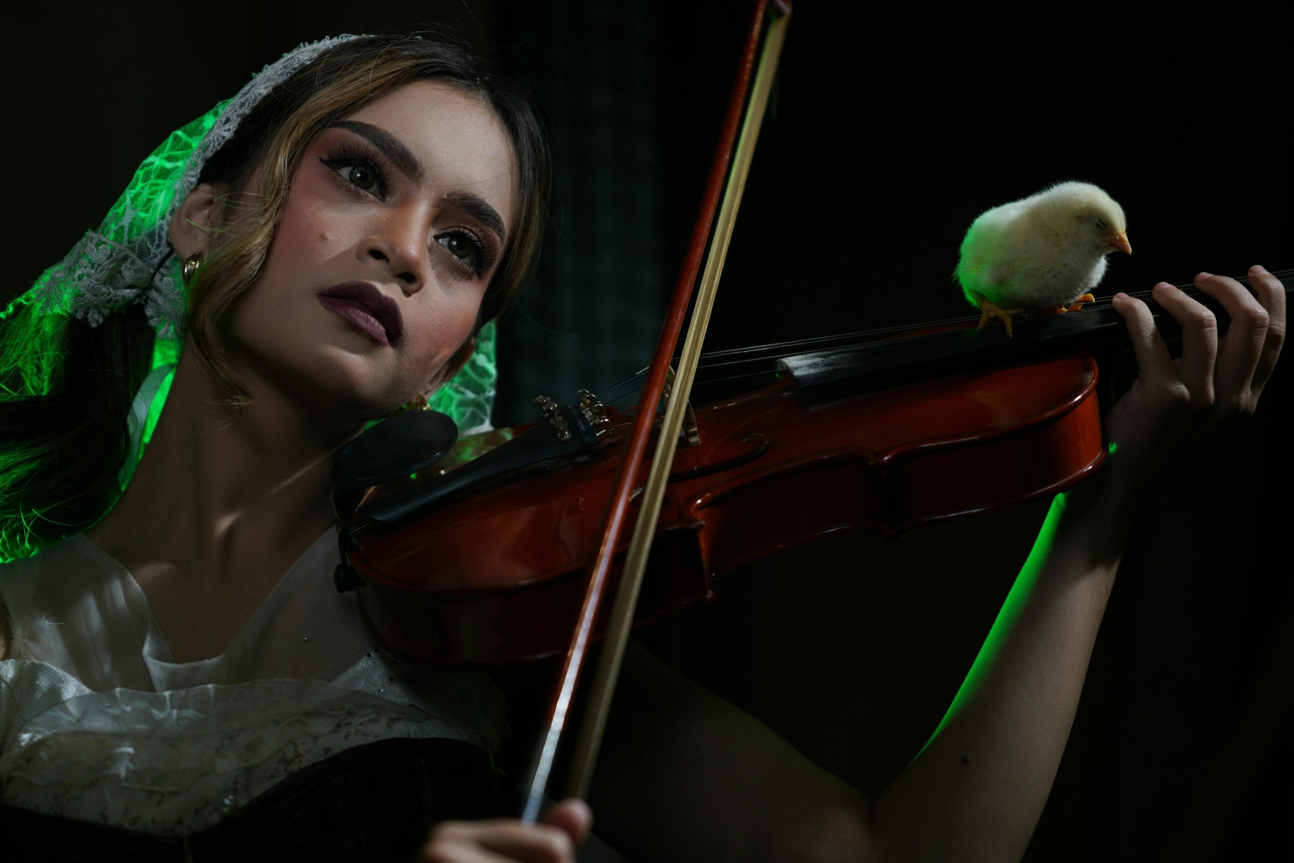 Bright stage lights highlighting dramatic makeup