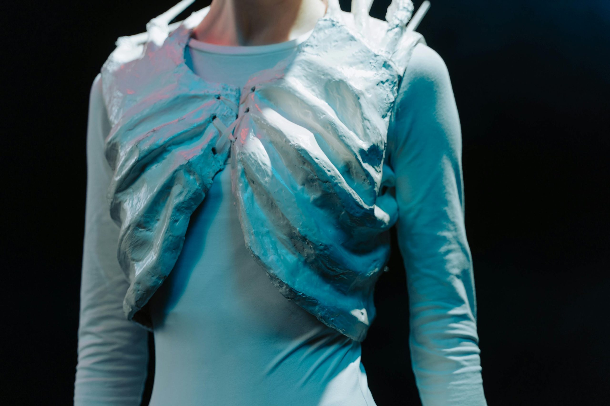 Close-up shot of intricate fantasy makeup resembling an alien queen with metallic details