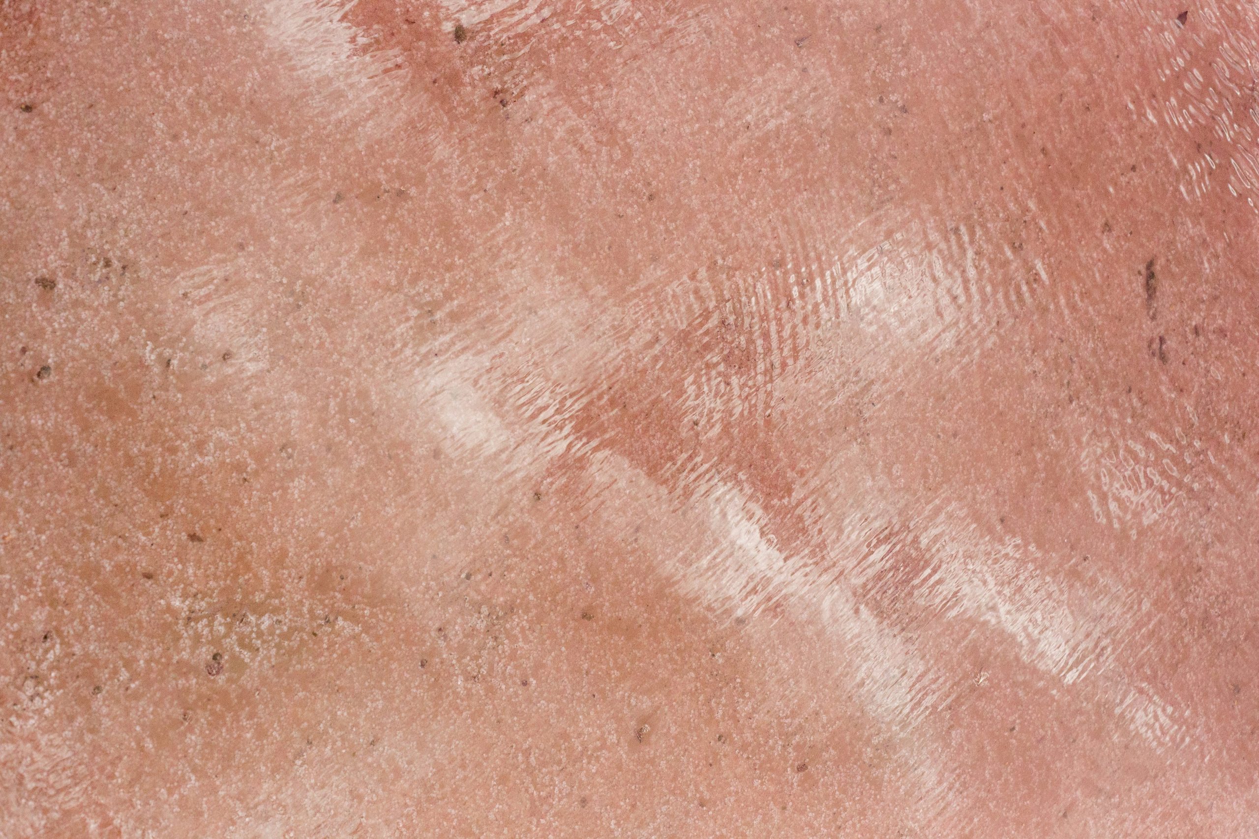 A close-up shot of cracked skin sfx makeup applied to an arm.