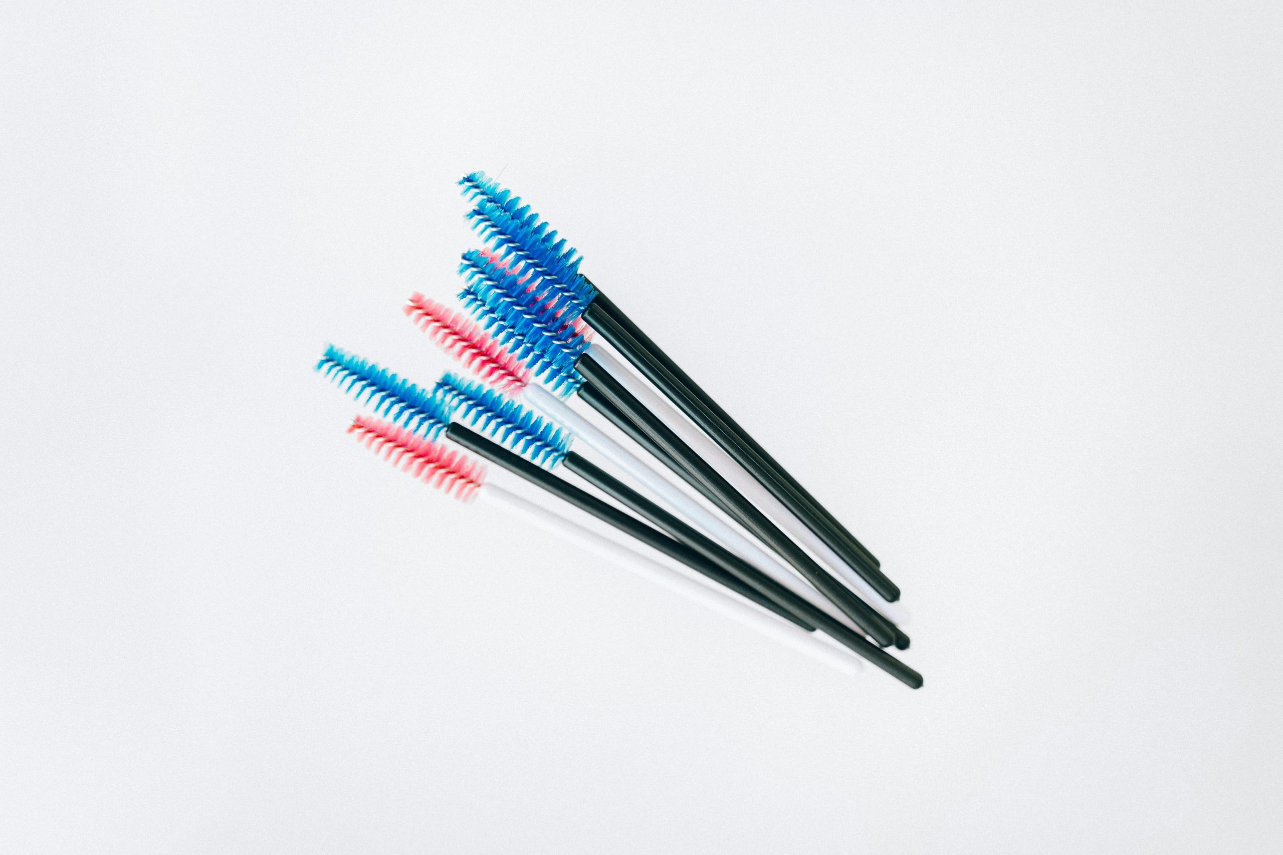 Close-up shot of professional-grade brushes, sponges, and special-effects makeup kits laid out neatly.