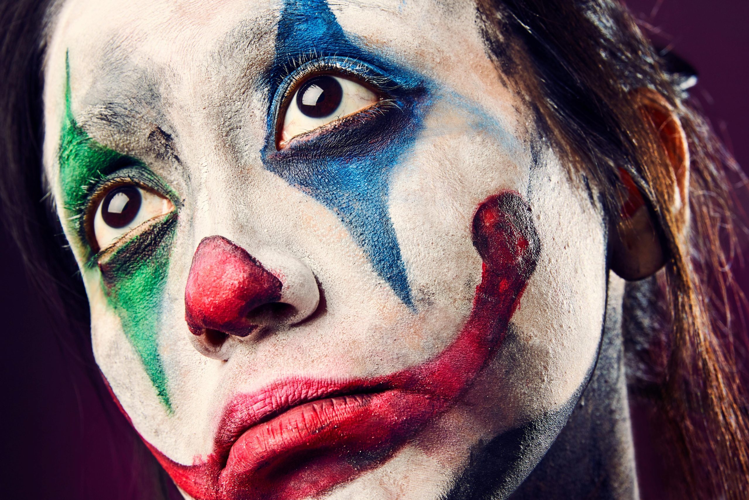 Scary professional clown makeup design example perfect for Halloween events