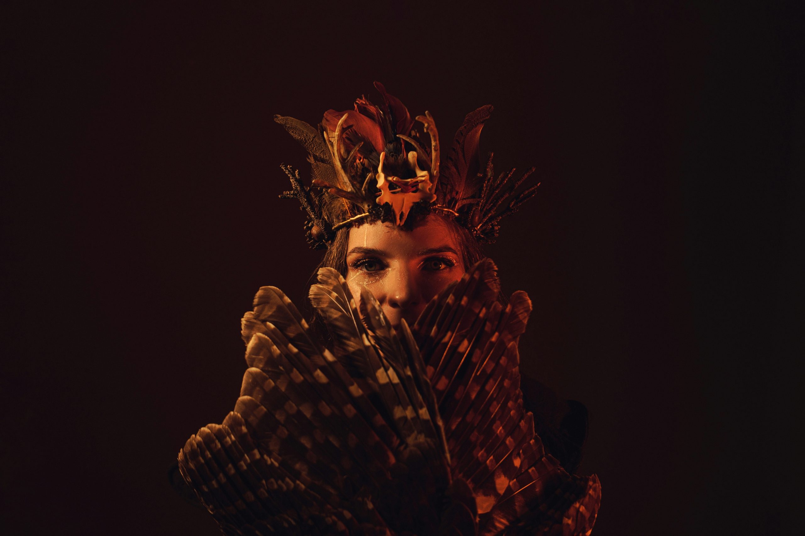Woman dressed as Medusa with detailed snake-themed makeup design