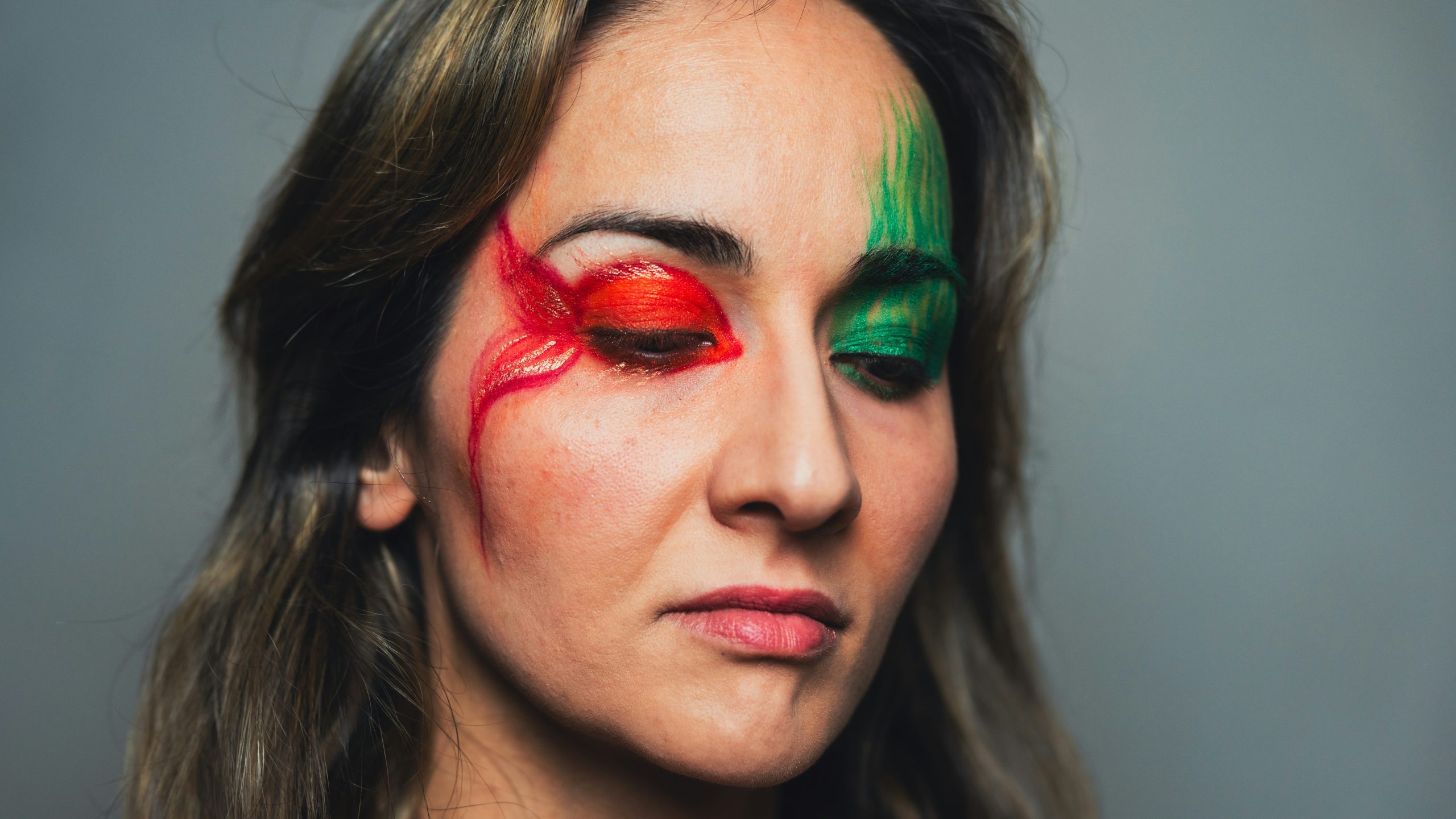Woman wearing stitched face scar makeup at a Halloween party
