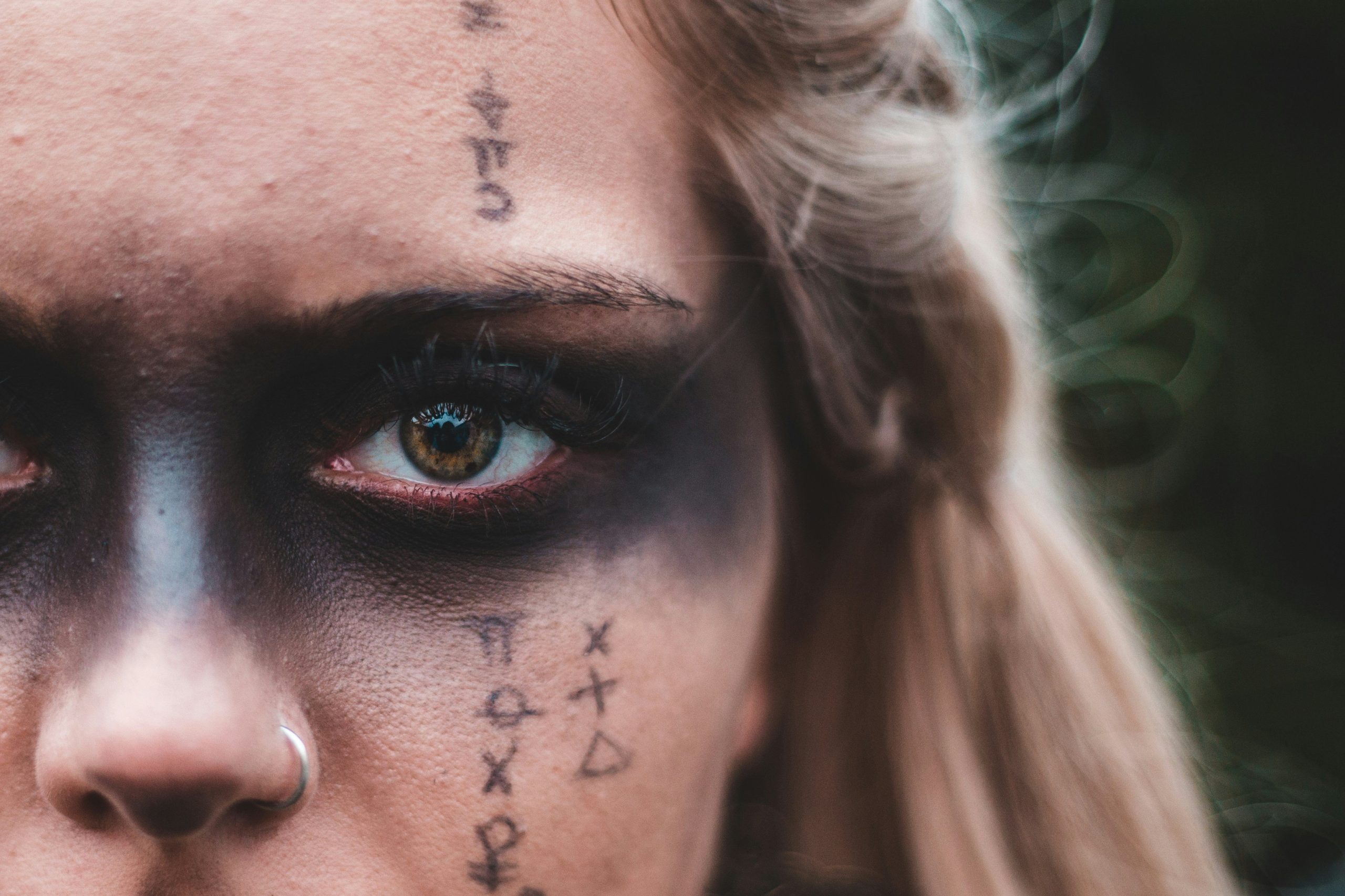 Model wearing exaggerated bold brows for a theatrical performance