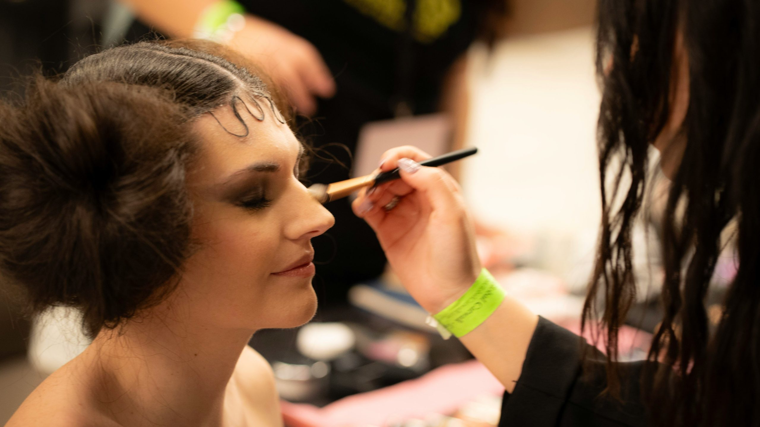 Sarah dressed as Morticia Addams with flawless white makeup against dark hair