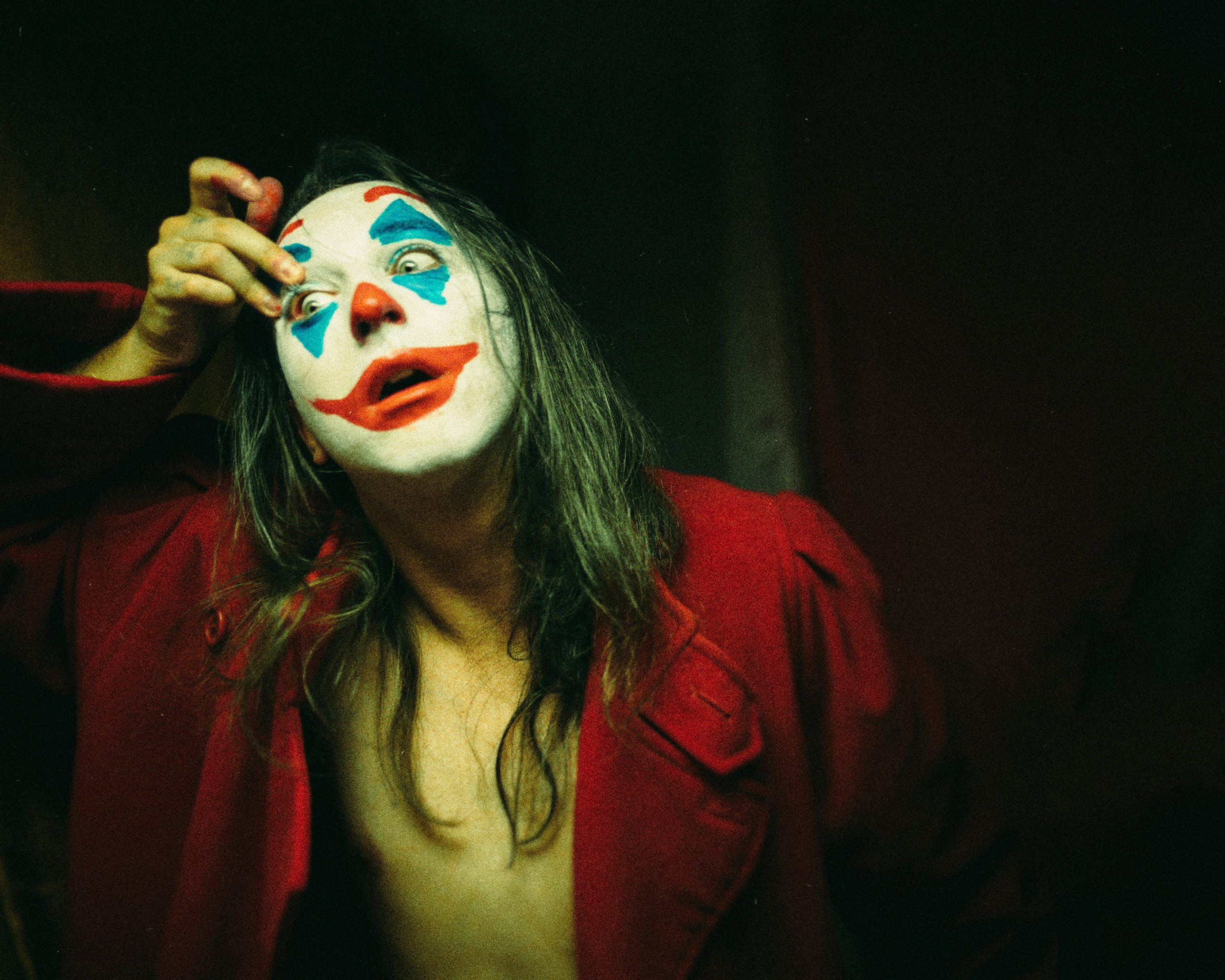 Three distinct clown makeup styles showcasing classic creepy, fun vibrant, and gothic glam themes side by side