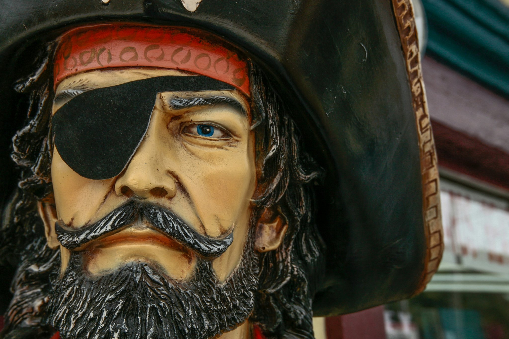 A close-up of professional pirate makeup featuring dramatic eyeliner and bold highlights.