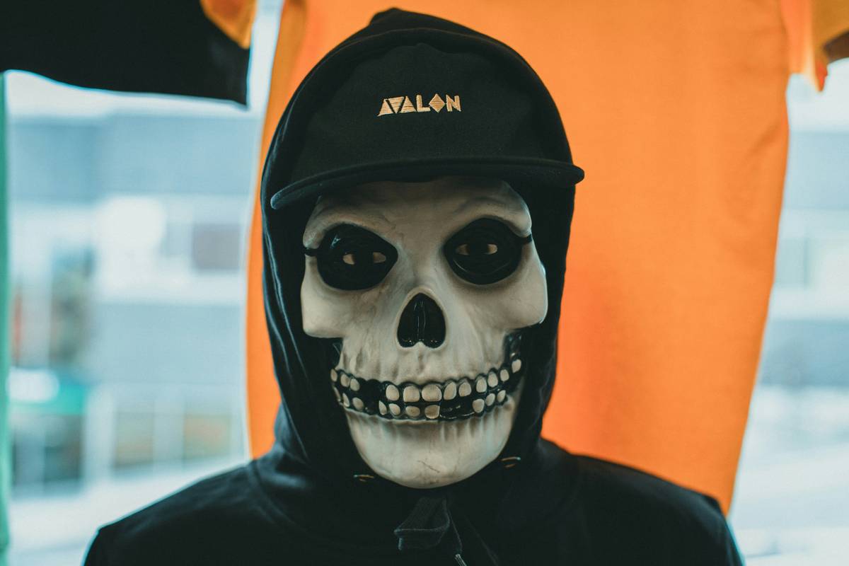 A woman dressed as Medusa with glowing snakes wrapped around her head.