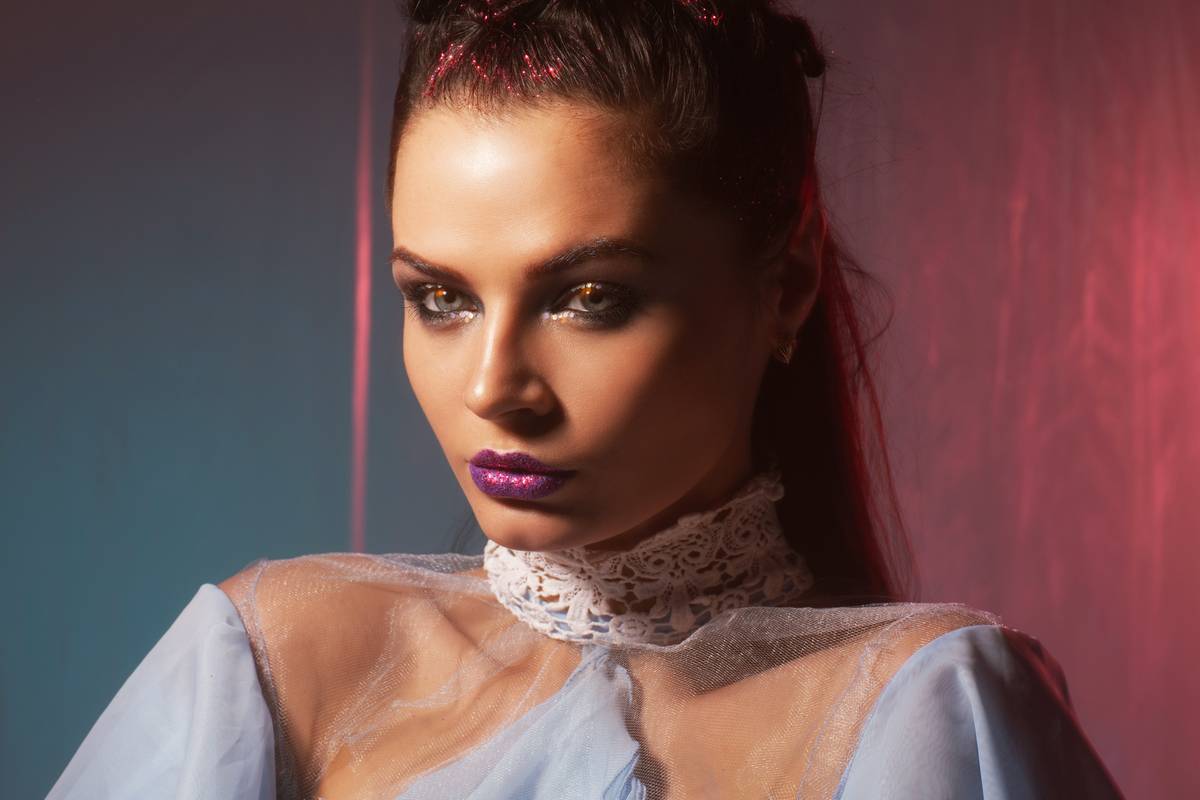 Close-up of a detailed zombie bride Halloween makeup look with torn veil effect