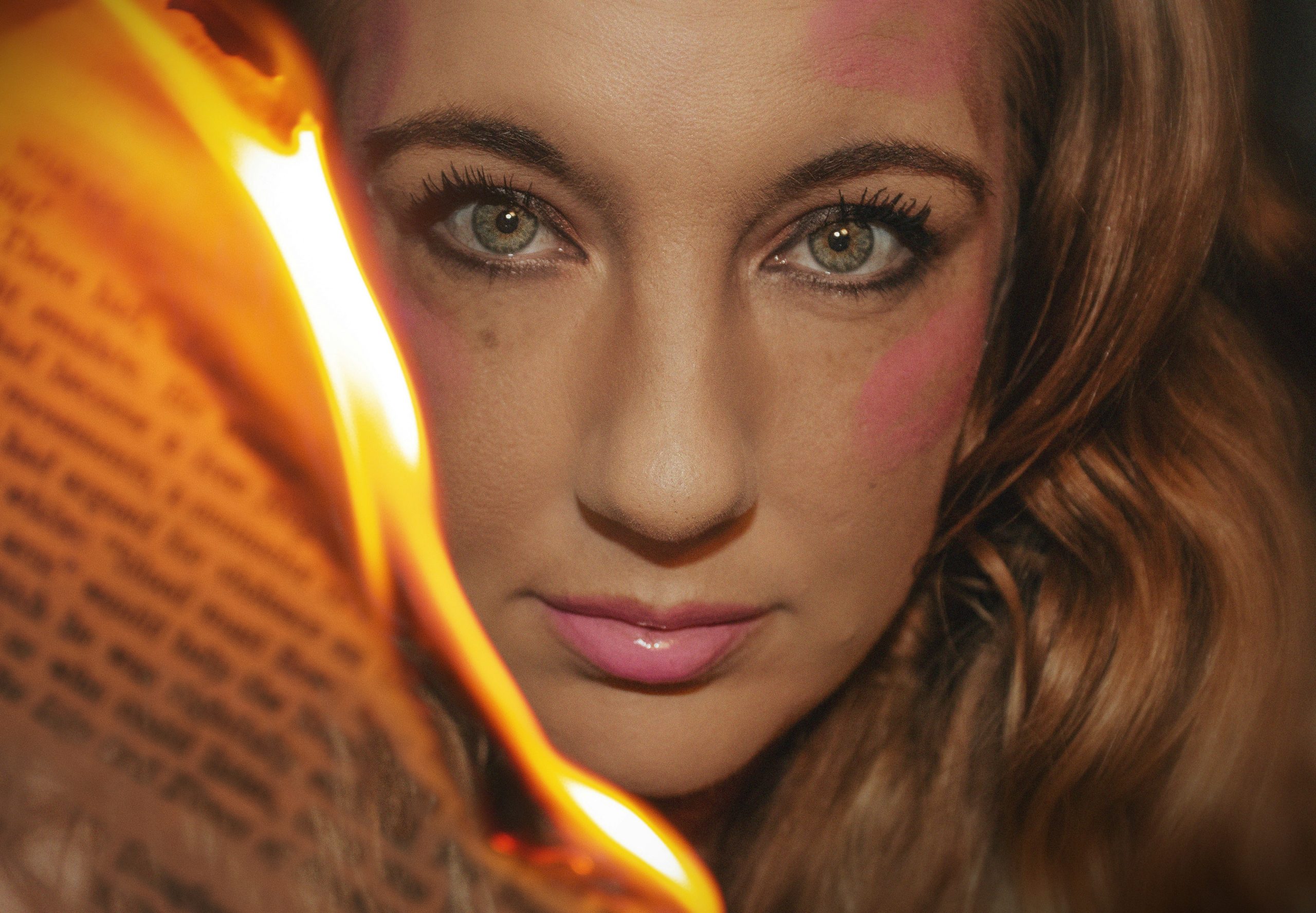 a close up of a person holding a book