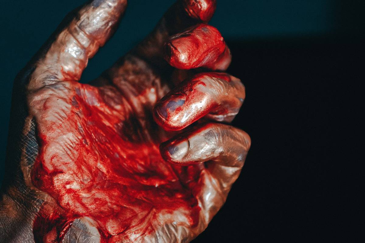 A close-up of homemade fake blood dripping down an arm