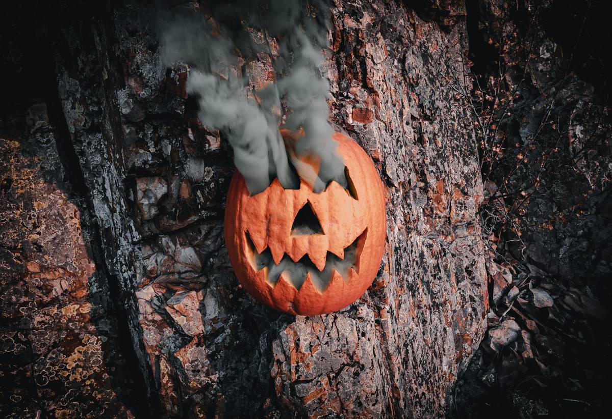 A close-up image of realistic fake blood dripping from a mock wound on someone's arm.